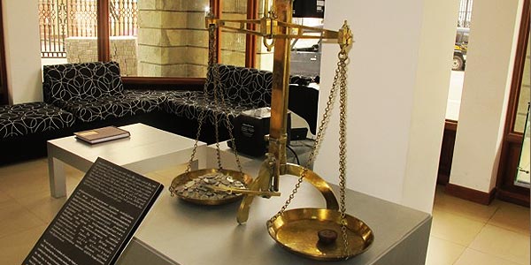 Old scale used for coin weighing