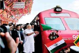 India's Premier Modi flags off the first train from Tlaimannar Pier